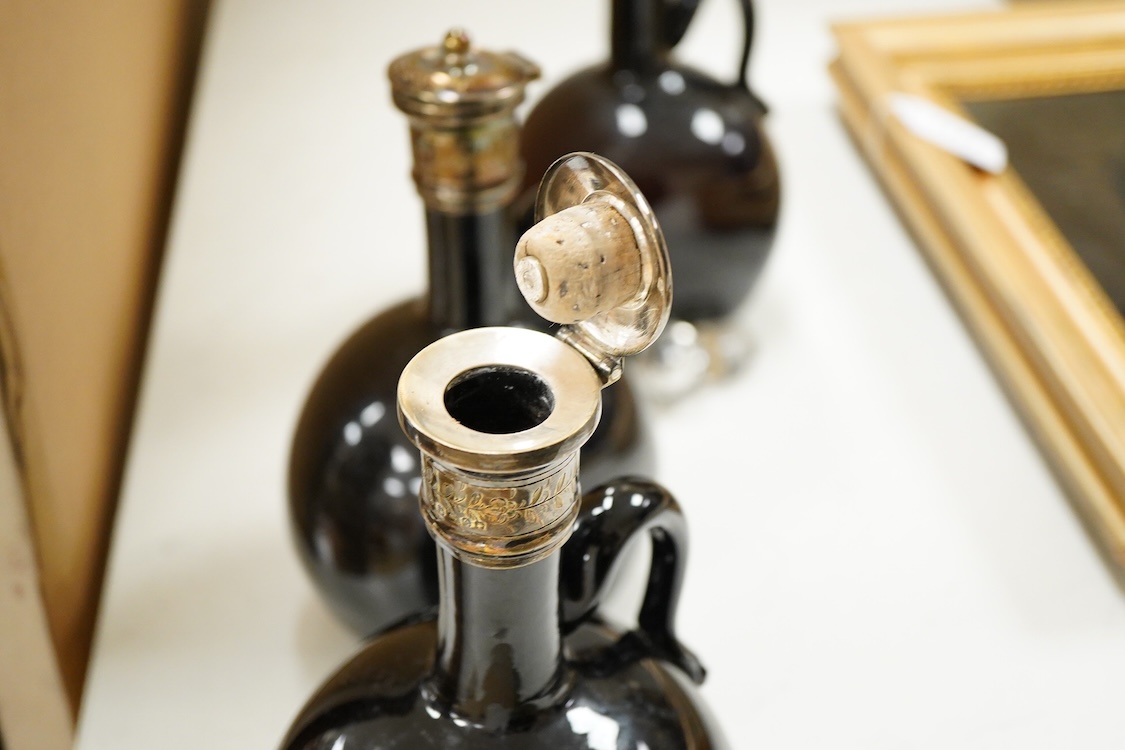 Three Victorian silver mounted glass spirit flasks, engraved 'Brandy', 'Whisky' and 'Gin', Atkin Brothers, Sheffield, 1874, 20.7cm.